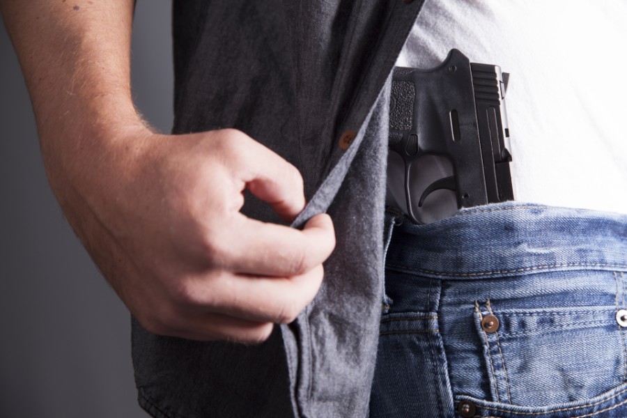 man carrying a gun on his waist | Carrying a Concealed Weapon